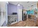 Bright kitchen features a stainless steel refrigerator, lots of storage, and adjacent dining area at 411 Ryans Ridge Ave, Eustis, FL 32726