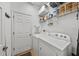 Functional laundry room with a washing machine, dryer, and wire shelving at 411 Ryans Ridge Ave, Eustis, FL 32726