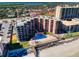 Aerial view of a condo with beach access and a pool at 4141 S Atlantic Ave # 605, New Smyrna Beach, FL 32169