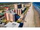 Beachside condominiums with beach access, a community pool, and a sandy shoreline at 4141 S Atlantic Ave # 605, New Smyrna Beach, FL 32169