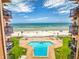 Aerial view of the property showcasing the pool, beach access, and ocean view at 4141 S Atlantic Ave # 605, New Smyrna Beach, FL 32169