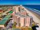 A condo complex along the beach featuring tennis courts and a shuffleboard court at 4141 S Atlantic Ave # 605, New Smyrna Beach, FL 32169