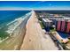 A beautiful aerial view of the beach and condos at 4141 S Atlantic Ave # 605, New Smyrna Beach, FL 32169