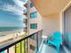 Charming balcony with ocean view and seating, perfect for enjoying the scenery at 4141 S Atlantic Ave # 605, New Smyrna Beach, FL 32169