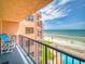 View from the balcony overlooking the beach, ocean, and outdoor pool at 4141 S Atlantic Ave # 605, New Smyrna Beach, FL 32169