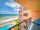 Condo balcony overlooking the beach, ocean, and outdoor pool area at 4141 S Atlantic Ave # 605, New Smyrna Beach, FL 32169