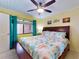 Inviting bedroom features natural lighting, beach-themed bedding, and warm yellow walls at 4141 S Atlantic Ave # 605, New Smyrna Beach, FL 32169