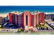 Stunning oceanfront building with multiple balconies, complemented by tennis courts and parking at 4141 S Atlantic Ave # 605, New Smyrna Beach, FL 32169