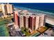 A beautiful condo complex near the ocean featuring balconies and a parking lot at 4141 S Atlantic Ave # 605, New Smyrna Beach, FL 32169