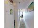Inviting hallway with updated decor, art and carpeting at 4141 S Atlantic Ave # 605, New Smyrna Beach, FL 32169
