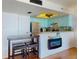 Well-equipped kitchen with bar seating and stainless steel appliances at 4141 S Atlantic Ave # 605, New Smyrna Beach, FL 32169