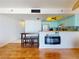 Modern kitchen with breakfast bar and view into living space at 4141 S Atlantic Ave # 605, New Smyrna Beach, FL 32169