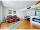Cozy living room featuring a comfortable sofa and modern decor at 4141 S Atlantic Ave # 605, New Smyrna Beach, FL 32169
