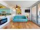 Living room with hardwood floors, modern furnishings and view at 4141 S Atlantic Ave # 605, New Smyrna Beach, FL 32169