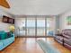 Cozy living room with ocean views, comfortable seating, and sliding glass doors at 4141 S Atlantic Ave # 605, New Smyrna Beach, FL 32169