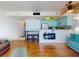 Living room with hardwood floors and view of the kitchen at 4141 S Atlantic Ave # 605, New Smyrna Beach, FL 32169