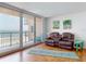 Inviting living room with balcony access and stunning ocean views at 4141 S Atlantic Ave # 605, New Smyrna Beach, FL 32169