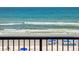 Relaxing ocean view from the balcony of this condo, with a sandy beach and gentle waves at 4141 S Atlantic Ave # 605, New Smyrna Beach, FL 32169