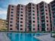 Relaxing pool area of a modern building with multiple levels, offering the perfect blend of comfort and luxury at 4141 S Atlantic Ave # 605, New Smyrna Beach, FL 32169