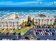 Beautiful aerial view of oceanfront condo complex with ample parking and beach access at 4175 S Atlantic Ave # 4110, New Smyrna Beach, FL 32169