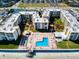 Overhead aerial shot of beach condominiums, with swimming pool, and recreation areas at 4175 S Atlantic Ave # 4110, New Smyrna Beach, FL 32169