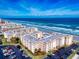 Breathtaking aerial view of beachfront condos with a pool, beach access, and convenient parking at 4175 S Atlantic Ave # 4110, New Smyrna Beach, FL 32169