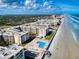 Gorgeous aerial view of condos with oceanfront access and manicured green spaces at 4175 S Atlantic Ave # 4110, New Smyrna Beach, FL 32169