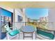 Balcony with seating offering a stunning view of manicured lawns, the beach, and the ocean beyond at 4175 S Atlantic Ave # 4110, New Smyrna Beach, FL 32169