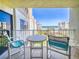 Relaxing balcony view with outdoor seating overlooking lush landscaping and the ocean at 4175 S Atlantic Ave # 4110, New Smyrna Beach, FL 32169