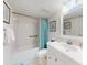 Clean bathroom featuring a tub and shower, a sink vanity, and neutral decor at 4175 S Atlantic Ave # 4110, New Smyrna Beach, FL 32169