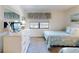 Comfortable bedroom with twin beds, dresser, and a soothing coastal decor for a relaxing vacation at 4175 S Atlantic Ave # 4110, New Smyrna Beach, FL 32169