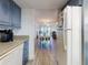 Bright kitchen with stainless steel appliances and a view of the dining and living areas at 4175 S Atlantic Ave # 4110, New Smyrna Beach, FL 32169