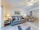 Comfortable living room with a sofa and ocean-themed decor at 4175 S Atlantic Ave # 4110, New Smyrna Beach, FL 32169