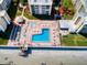 Aerial view showcasing the complex's pool, shuffleboard and beach access at 4175 S Atlantic Ave # 4110, New Smyrna Beach, FL 32169