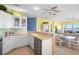 Stylish kitchen featuring stainless steel appliances, a breakfast bar, and an open layout to the dining area at 438 Bouchelle Dr # 105, New Smyrna Beach, FL 32169