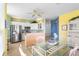 Charming eat-in kitchen with stainless steel appliances, white cabinetry, and bright, cheerful colors at 438 Bouchelle Dr # 105, New Smyrna Beach, FL 32169