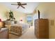 Cozy main bedroom featuring warm tones, a comfortable bed, and a private balcony at 438 Bouchelle Dr # 105, New Smyrna Beach, FL 32169