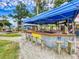 Fun outdoor bar with seating, perfect for enjoying beautiful views and relaxing with friends at 438 Bouchelle Dr # 105, New Smyrna Beach, FL 32169