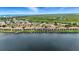 Scenic aerial view of waterfront condos, private boat docks, and lush landscaping at 454 Bouchelle Dr # 102, New Smyrna Beach, FL 32169