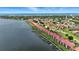 Amazing aerial view of waterfront condos with private boat docks, lush landscaping, and ocean views at 454 Bouchelle Dr # 102, New Smyrna Beach, FL 32169