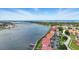 Panoramic aerial shot of waterfront condos featuring boat docks, and beautiful landscaping at 454 Bouchelle Dr # 102, New Smyrna Beach, FL 32169