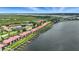 Breathtaking aerial view of waterfront condo community with boat docks and mature trees at 454 Bouchelle Dr # 102, New Smyrna Beach, FL 32169