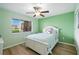 Bright bedroom featuring a ceiling fan and ample natural light at 454 Bouchelle Dr # 102, New Smyrna Beach, FL 32169