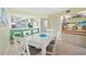Open dining area with bar and seamless access to the kitchen for easy serving at 454 Bouchelle Dr # 102, New Smyrna Beach, FL 32169
