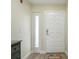This entryway features a white door and a welcome mat at 454 Bouchelle Dr # 102, New Smyrna Beach, FL 32169