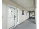 Exterior hallway leading to unit 102 at 454 Bouchelle Dr # 102, New Smyrna Beach, FL 32169
