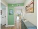 Welcoming hallway with a serene view and coastal decor at 454 Bouchelle Dr # 102, New Smyrna Beach, FL 32169