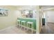 Kitchen bar with seating area for enjoying meals next to an updated kitchen at 454 Bouchelle Dr # 102, New Smyrna Beach, FL 32169