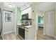 A cozy kitchen features a range, microwave, and stylish decor at 454 Bouchelle Dr # 102, New Smyrna Beach, FL 32169