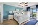Well-lit main bedroom featuring a ceiling fan and outdoor access at 454 Bouchelle Dr # 102, New Smyrna Beach, FL 32169